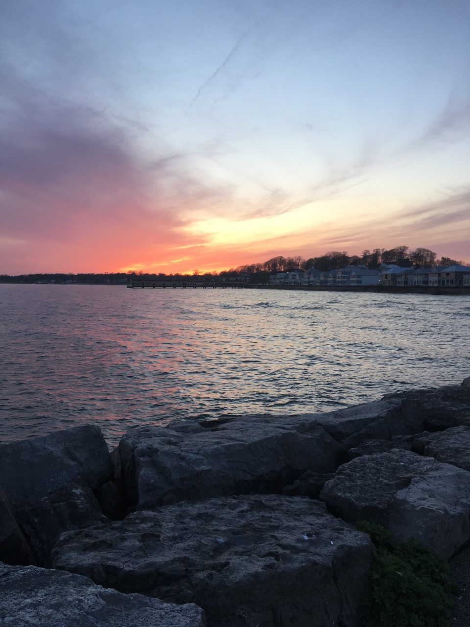 Sunset over Lake Erie with rocky shore