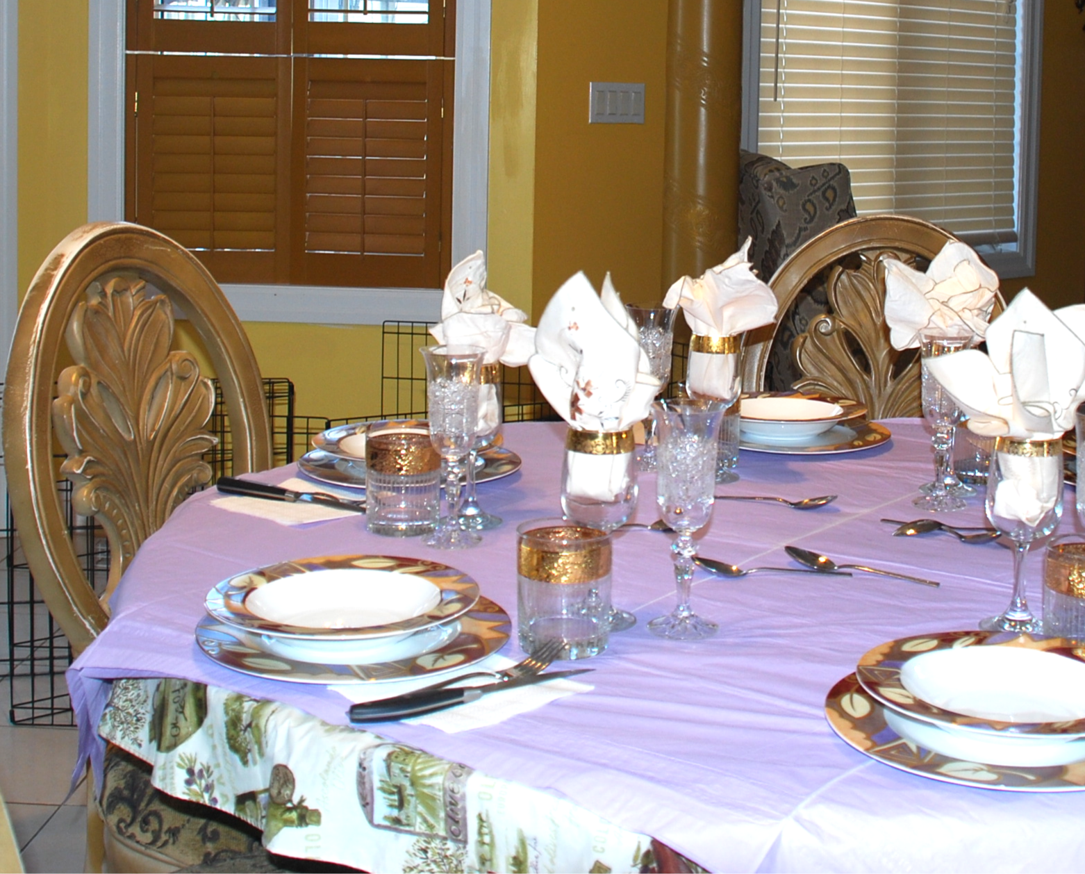 Elegant dining table with ornate chairs and fine tableware